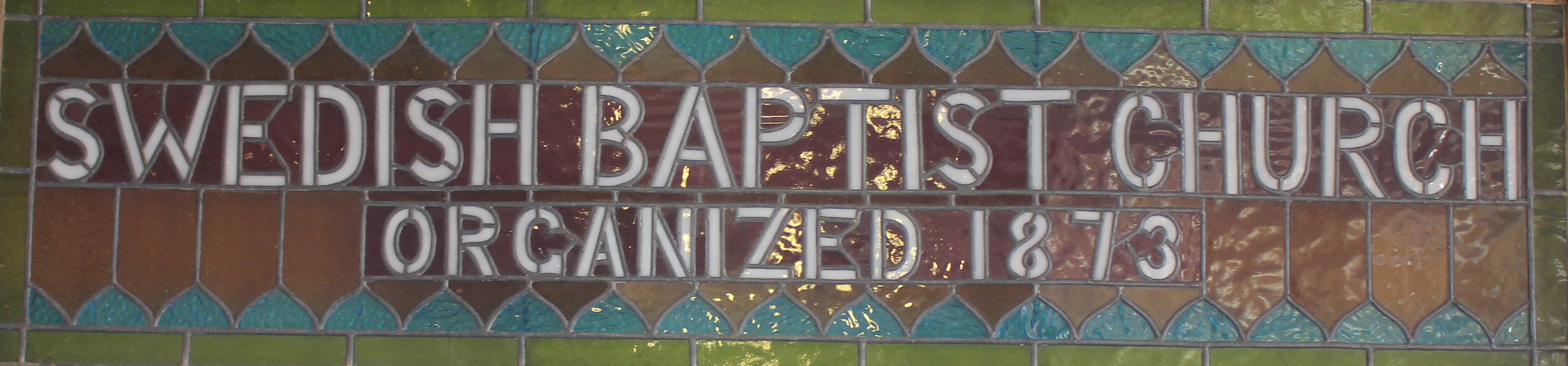 Swedish Baptist Church, organized 1873 stain glass window.
